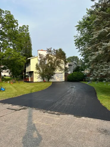 Newly paved smooth asphalt driveway