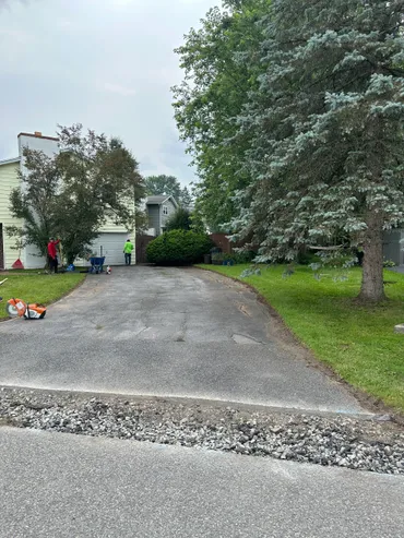 Old cracked asphalt driveway before paving